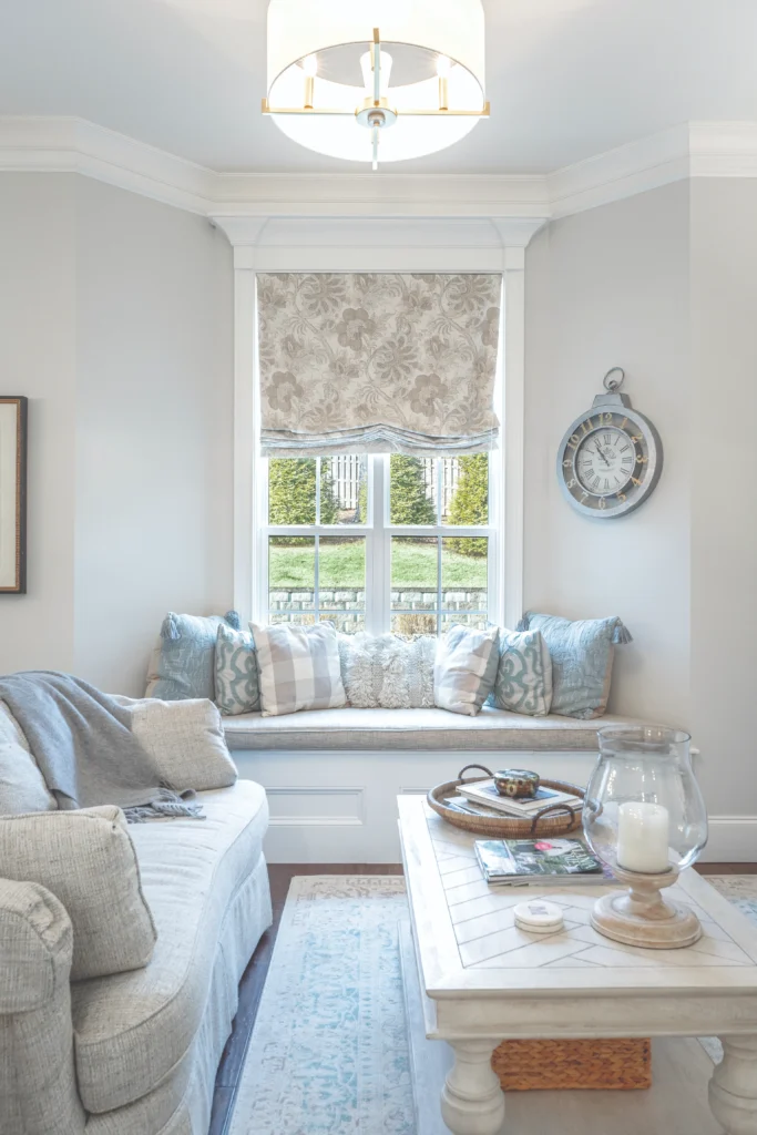 Custom arched plantation shutters installed in a Chattanooga home with tall windows and elegant interior design